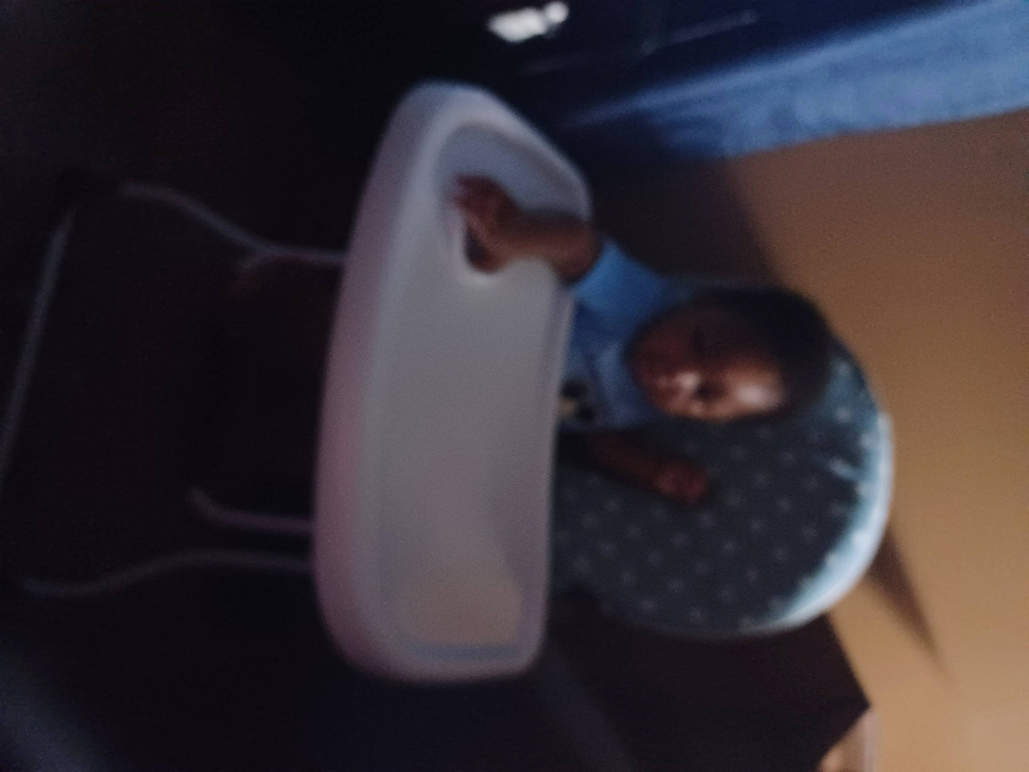 King is registered to the contest to win money with this photo: audio_equipment, automotive_lighting, carmine, circle, cup, darkness, drinkware, flooring, pattern, person, plastic, under_exposed, wood