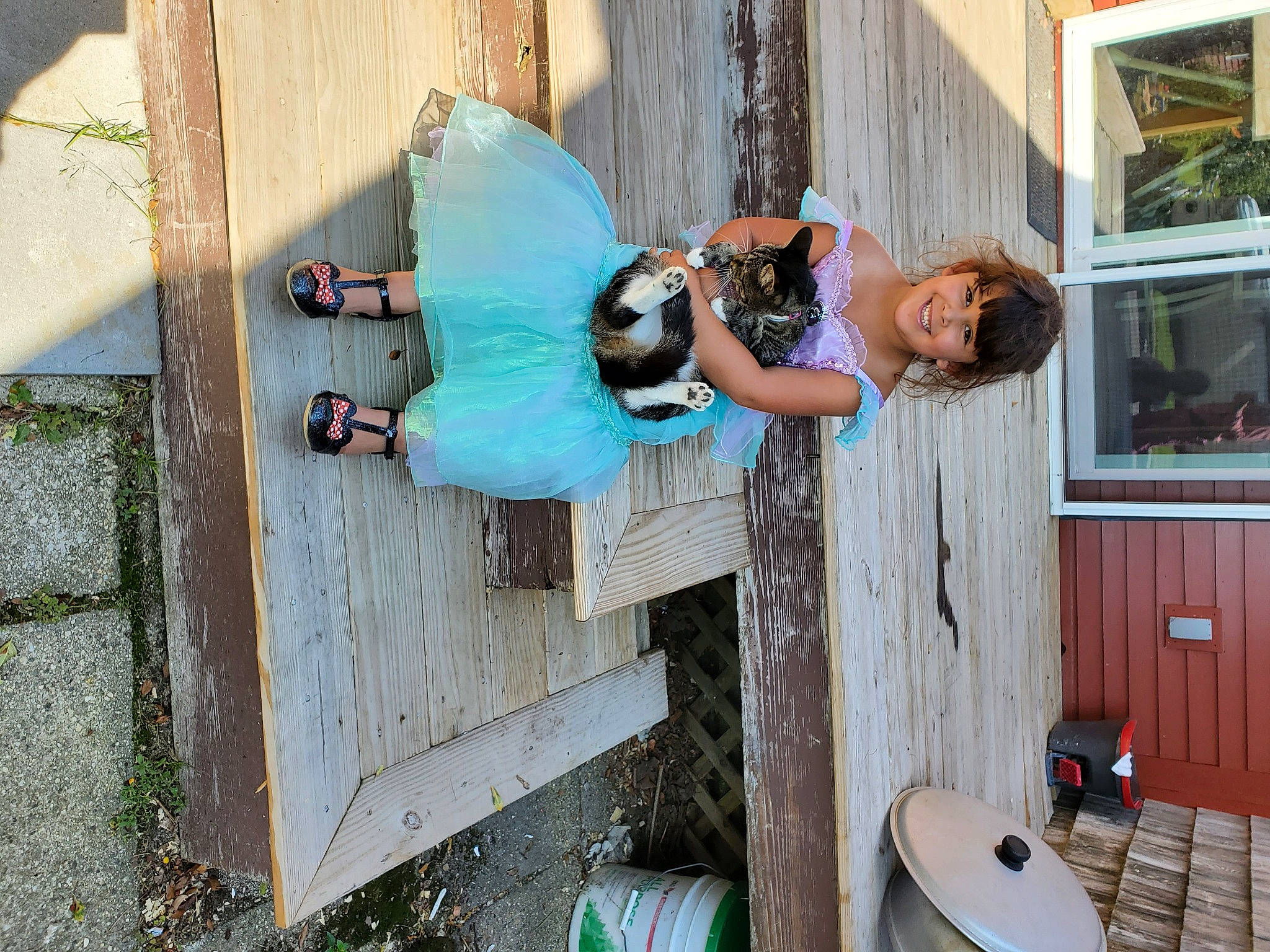 Sapphire is registered to the contest to win money with this photo: chair, fun, grass, hardwood, house, joy, leisure, person, recreation, shorts, smile, stool, t_shirt, vacation, window, wood