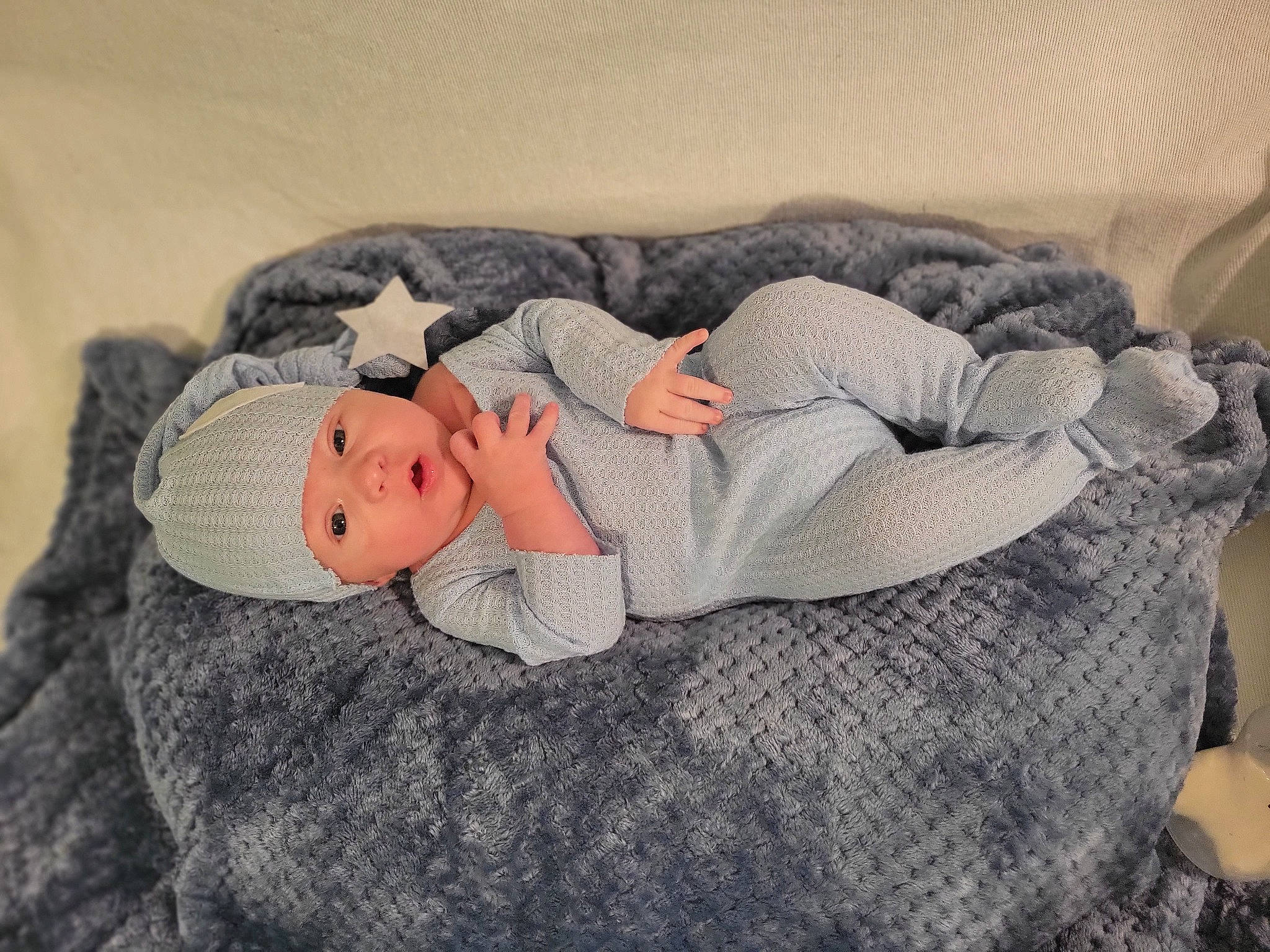 Taylor is registered to the contest to win money with this photo: baby, baby_sleeping, baby_toddler_clothing, child, comfort, fur, grey, headgear, headwear, linens, mammal, nap, pattern, person, room, sitting, sleeve, textile, toddler, vertebrate