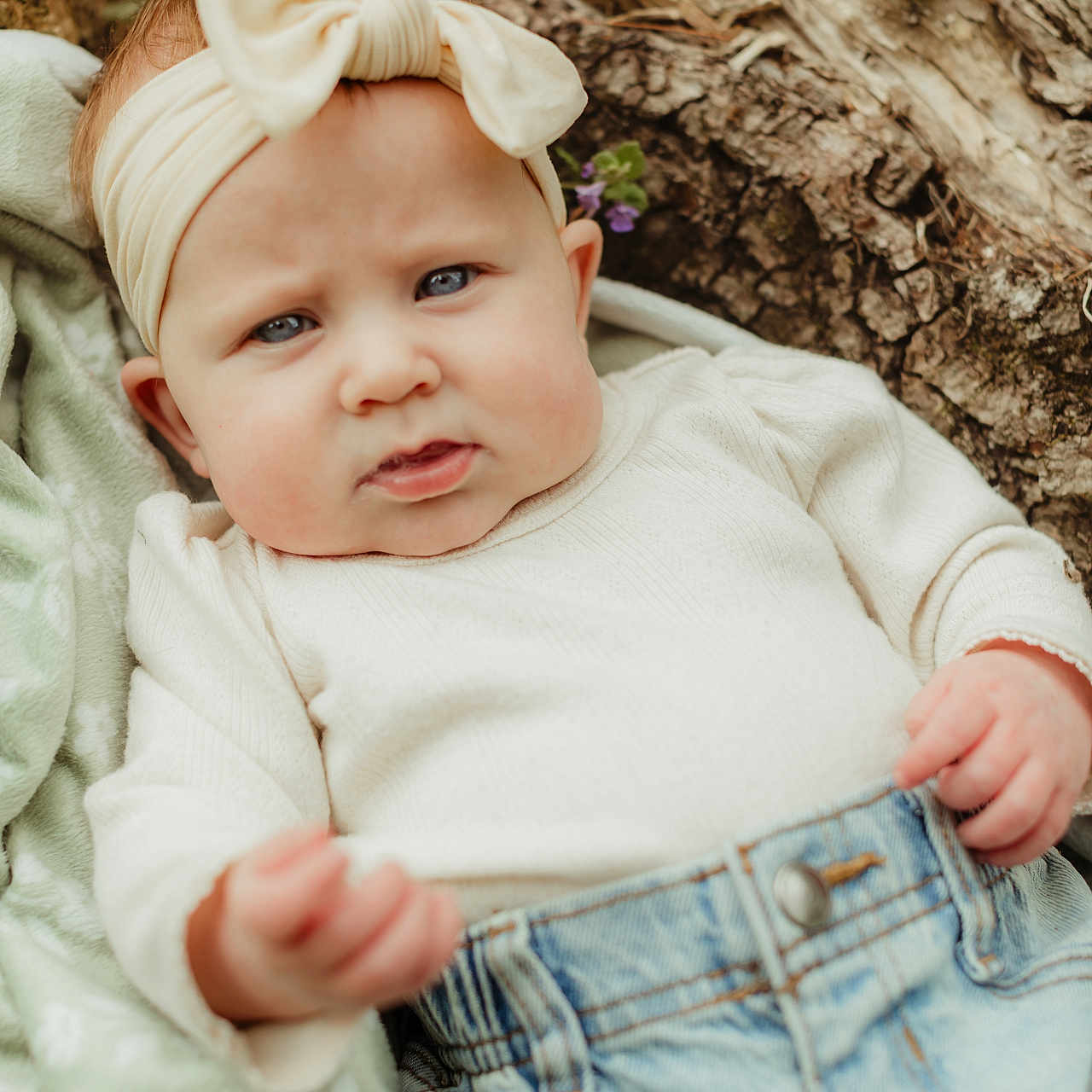 Callahan joined the competition — help win amazing prizes! baby, blanket, bow, casual_clothing, child, closeup, cream_color, cute, denim, expression, headband, infant, jeans, nature, outdoor, person, portrait, relaxed, sweater, tree_bark