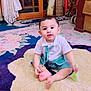Wahaj is registered to the contest to win money with this photo: baby, carpet, child, clothing, curious, curtain, cute, door, floor, floral_pattern, footwear_barefoot, furniture, home, indoor, infant, person, rug, sitting, toy, wooden