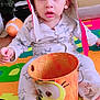 Wahaj joined the competition — help win amazing prizes! aviator_hat, bucket, bucket_with_face, candid, child, clothing, colorful_mat, curious, expression, face, floor_mat, foot, hat, indoor, playful, star_pattern, toddler, toy, toy_truck, young_child
