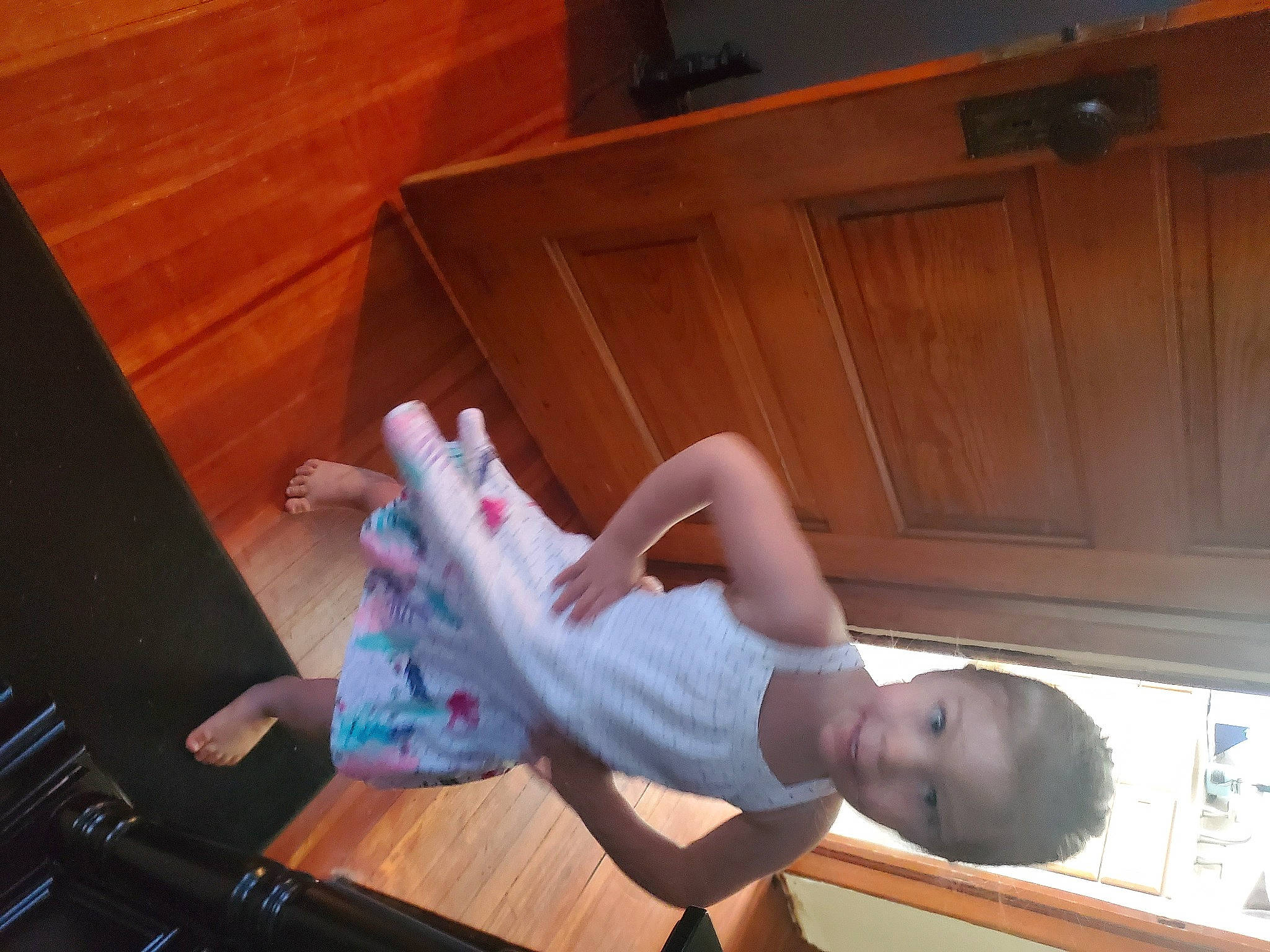 Cheyanne joined the competition — help win amazing prizes! barefoot, cabinetry, child, comfort, elbow, flooring, foot, fun, hardwood, human_leg, knee, person, room, sandal, sitting, sock, sportswear, thigh, toddler, wood