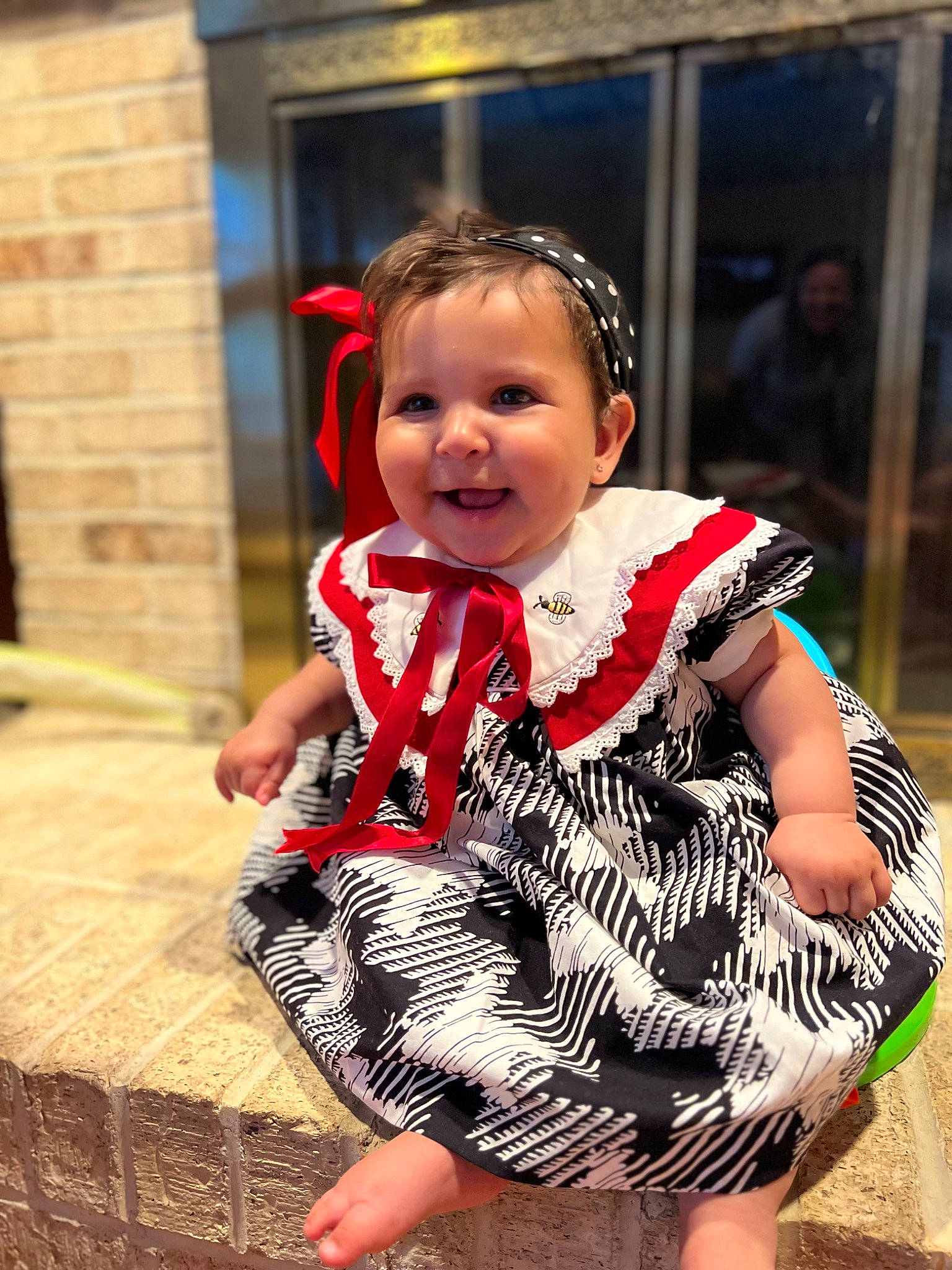 Paisley-mae is registered to the contest to win money with this photo: baby, baby_toddler_clothing, barefoot, child, day_dress, event, eye, fashion_accessory, foot, fun, happy, human_leg, jewellery, joy, necklace, pattern, person, sitting, smile, thigh