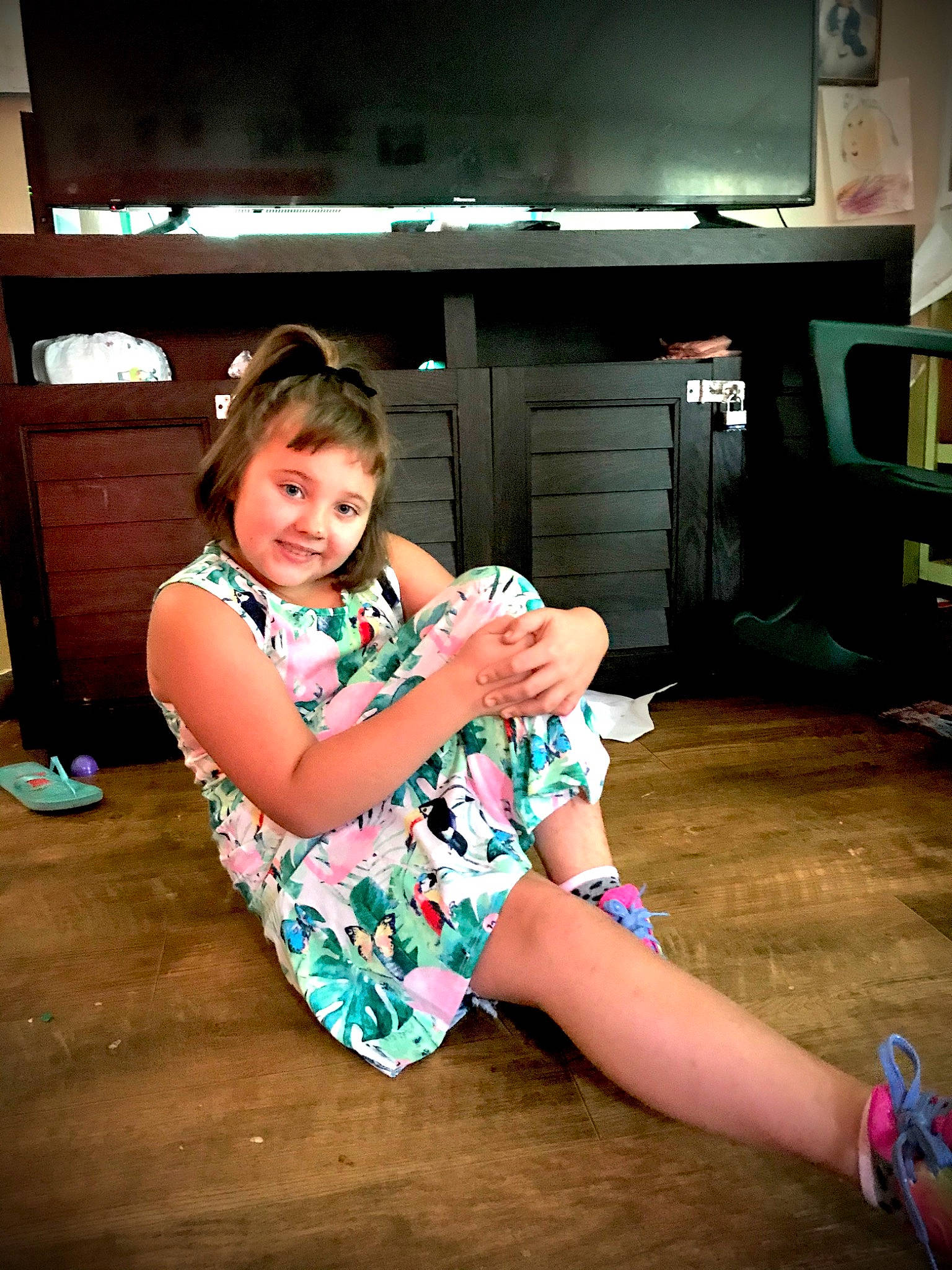 Charlie is registered to the contest to win money with this photo: child, flooring, fun, joy, leg, person, photography, sitting, smile, thigh, vacation
