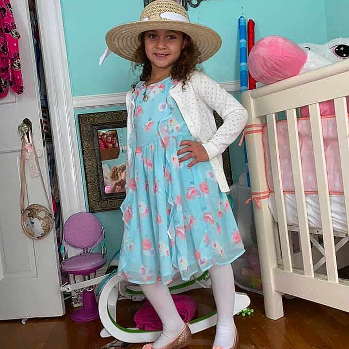 Elizabeth is registered to the contest to win money with this photo: baby_toddler_clothing, child, clothing, costume, dress, hat, headwear, joy, outerwear, pattern, person, pink, product, room, sleeve, toddler