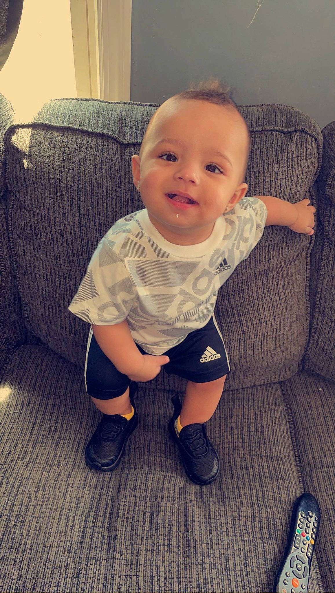 Taveare Jr is registered to the contest to win money with this photo: baby, baby_toddler_clothing, cheek, chin, comfort, cool, finger, happy, iris, leg, nose, person, shoe, shorts, skin, sleeve, smile, sneakers, t_shirt, tints_and_shades