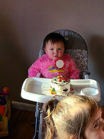 Zillie is registered to the contest to win money with this photo: baby, baked_goods, cake, child, comfort_food, cuisine, dessert, dish, dishware, eating, meal, pastry, person, plate, porcelain, serveware, sitting, sweetness, tableware, toddler