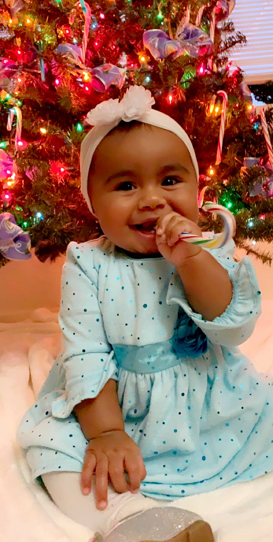 Abigail is registered to the contest to win money with this photo: child, christmas, christmas_decoration, christmas_ornament, hair_accessory, holiday, infant, joy, person, smile, toddler