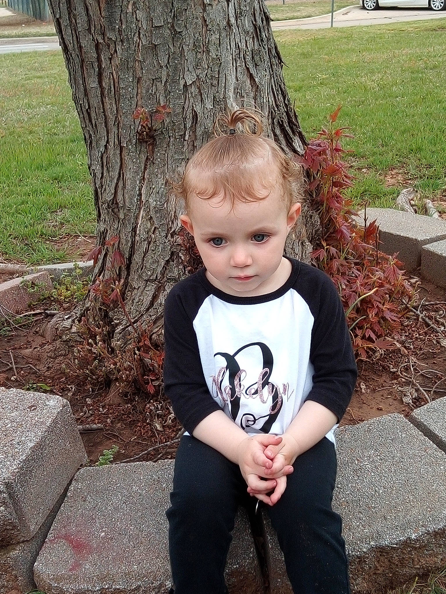 Blakelyn joined the competition — help win amazing prizes! child, grass, leaf, person, plant, sitting, smile, spring, t_shirt, toddler, tree