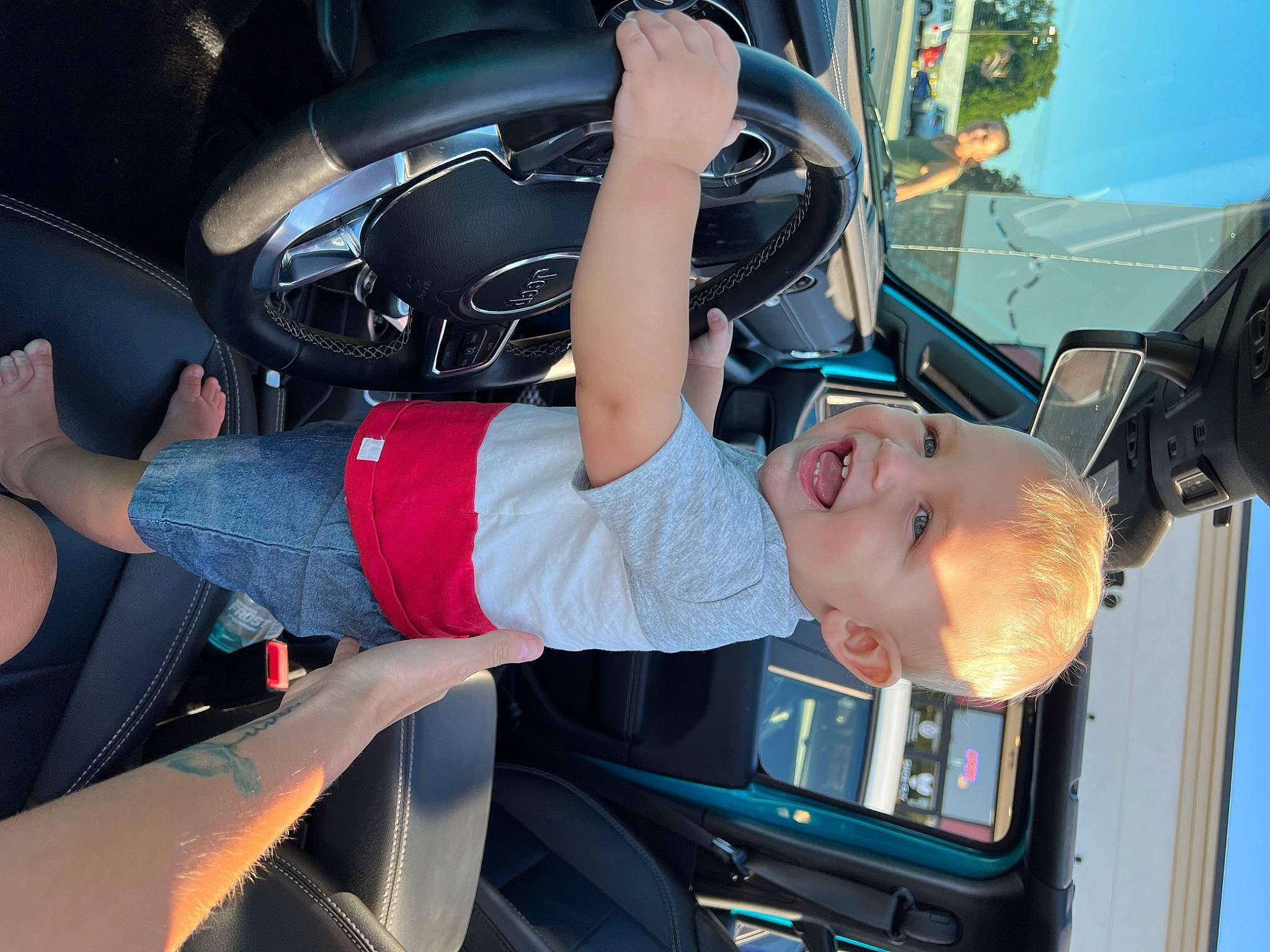 Landon joined the competition — help win amazing prizes! auto_part, automotive_design, automotive_exterior, automotive_lighting, automotive_tire, automotive_wheel_system, bumper, car, electric_blue, hood, motor_vehicle, person, personal_luxury_car, rim, sneakers, thigh, tire, toddler, vehicle, vehicle_door