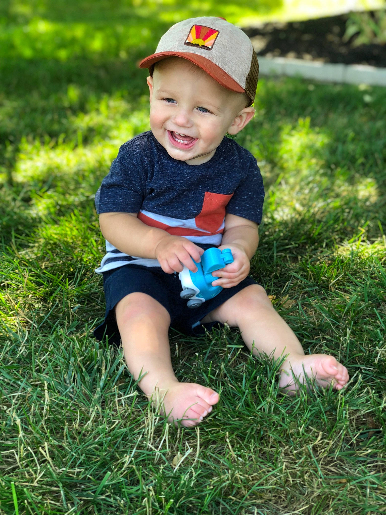 Landon joined the competition — help win amazing prizes! baby_toddler_clothing, botany, facial_expression, finger, flash_photography, fun, grass, grassland, happy, headwear, joy, natural_environment, people_in_nature, person, photograph, plant, skin, smile, standing, summer