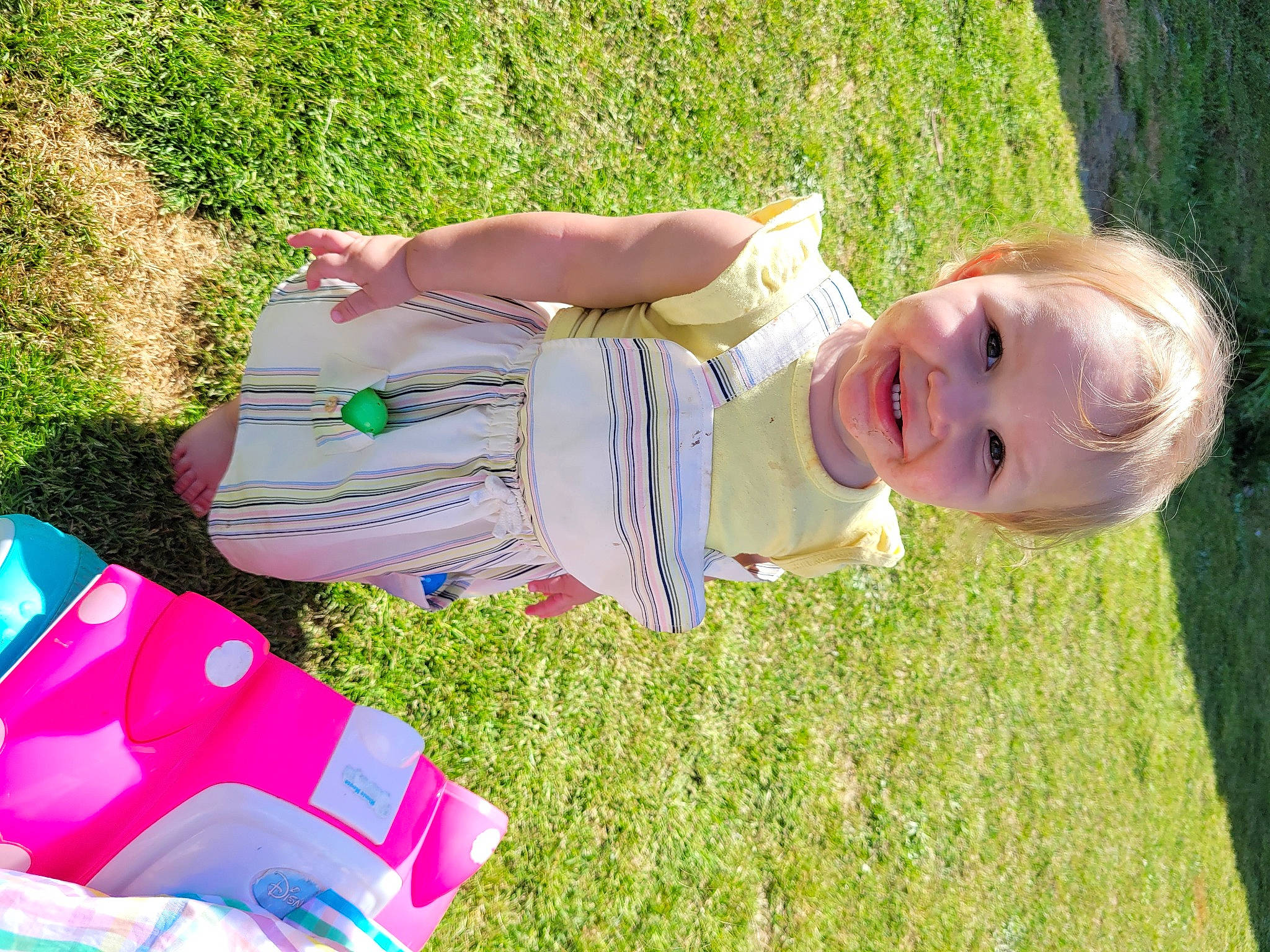 Krystal is registered to the contest to win money with this photo: baby, baby_toddler_clothing, bag, child, fun, grass, grass_family, grassland, happy, lawn, leaf, leisure, luggage_and_bags, meadow, people, people_in_nature, person, plant, smile, t_shirt