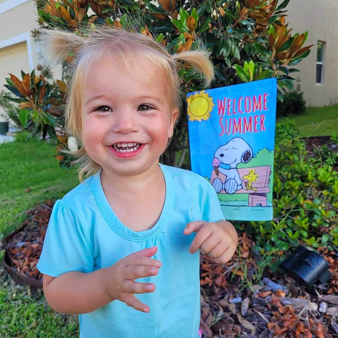 Lavender is registered to the contest to win money with this photo: advertisement, backyard, child, clothing, face, female, girl, grass, head, nature, outdoors, person, photography, plant, portrait, pottedplant, summer, t_shirt, tree, yard