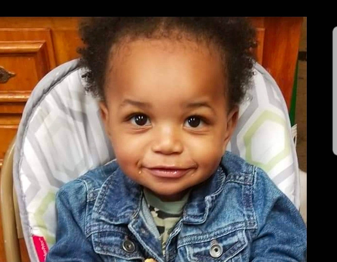 Diego is registered to the contest to win money with this photo: baby_toddler_clothing, black_hair, cabinetry, cheek, chin, denim, ear, eye, eyebrow, flash_photography, forehead, fun, happy, iris, joy, mouth, nose, person, sleeve, smile