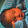 Jonahh is registered to the contest to win money with this photo: baby, sleeping, blanket, blue, pajamas, cozy, infant, peaceful, soft, cute, child, face, rest, indoors, newborn, warm, comfort, portrait, toddler, nap