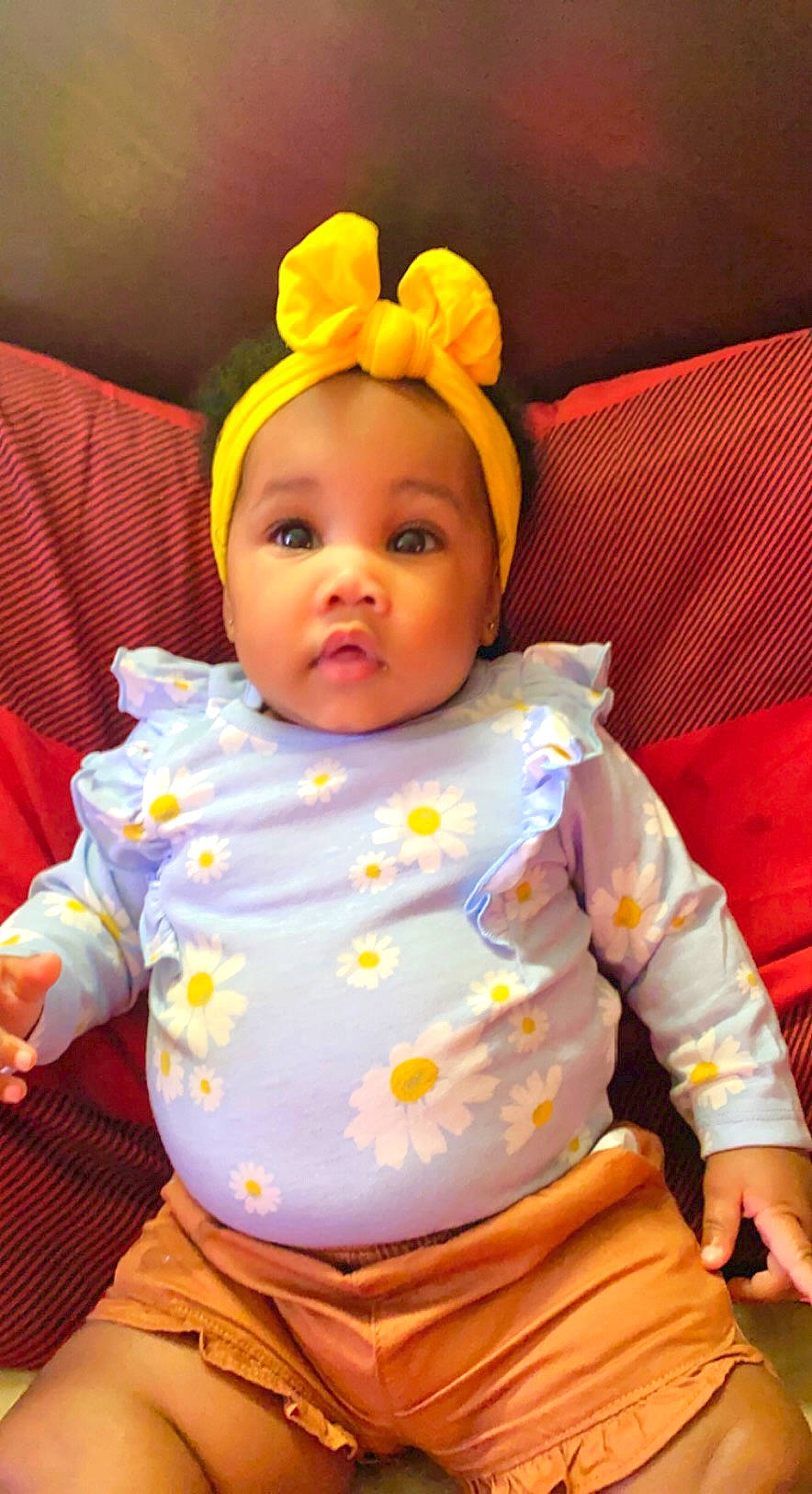 Khatoriyah is registered to the contest to win money with this photo: baby, baby_toddler_clothing, cheek, chin, eye, finger, happy, head, human, human_body, iris, nose, orange, person, pink, skin, sleeve, textile, toddler, white