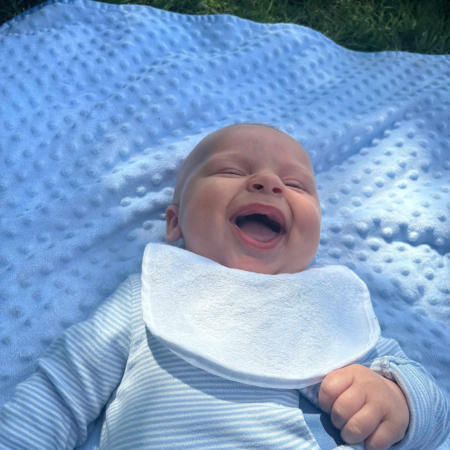 Codey-Jack joined the competition — help win amazing prizes! baby, blue_blanket, child, closed_eyes, cute, grass, hand, happy, head, infant, lying_down, mouth_open, outdoor, portrait, skin, smiling, soft_texture, striped_onesie, sunlight, white_bib