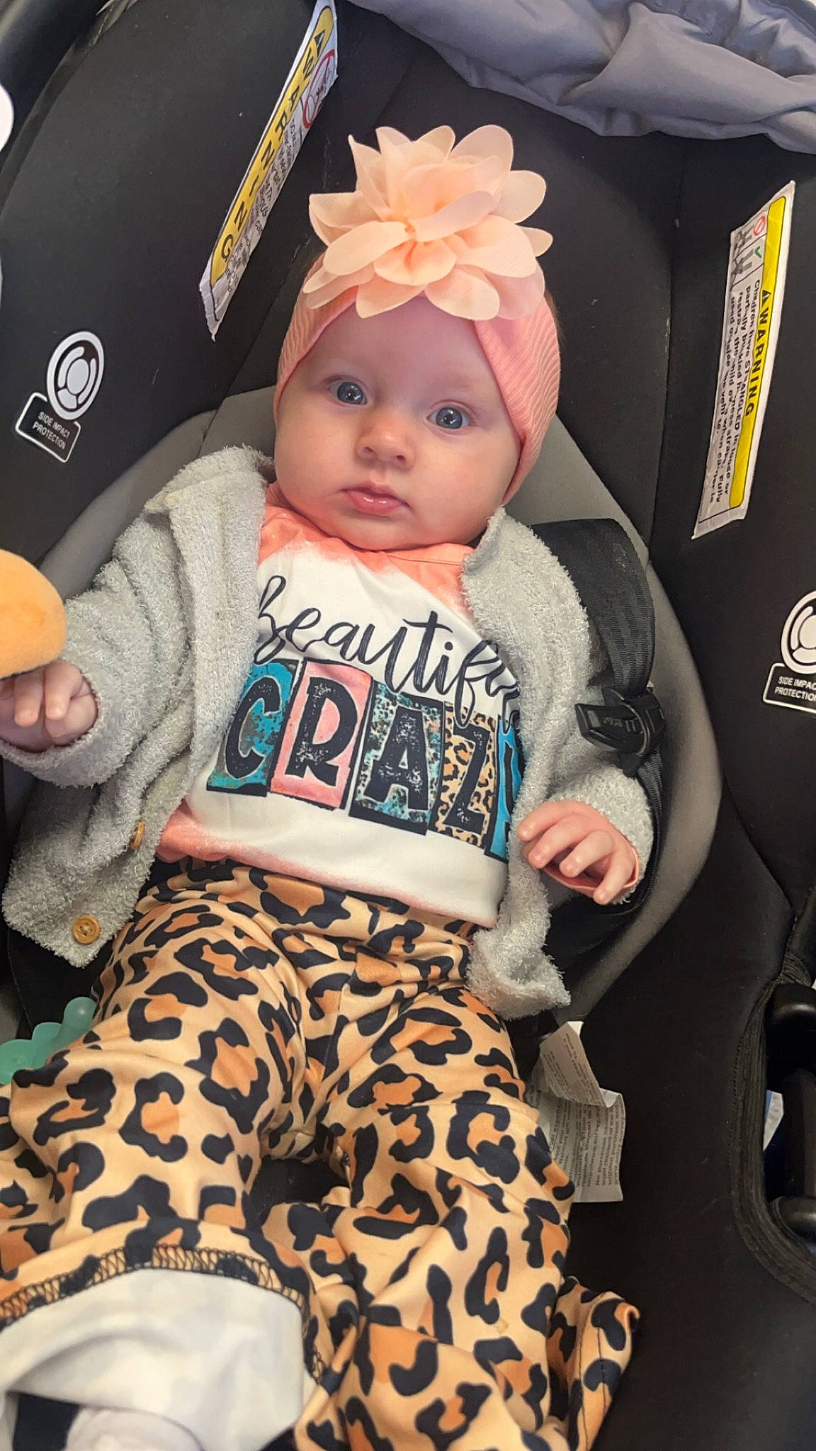 Kinsley joined the competition — help win amazing prizes! baby, baby_products, baby_toddler_clothing, child, costume_hat, eye, face, fashion_accessory, finger, hat, head, headband, headwear, orange, pattern, person, pink, sitting, skin, sleeve