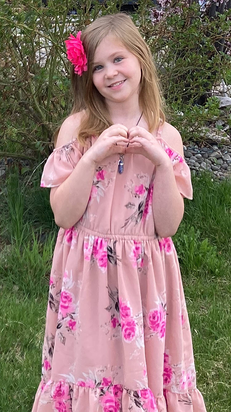 Callie joined the competition — help win amazing prizes! botany, clothing, day_dress, dress, flower, formal_wear, grass, happy, joy, lip, magenta, one_piece_garment, people_in_nature, person, pink, plant, skin, sleeve, smile, summer