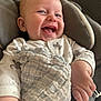 Kairo is registered to the contest to win money with this photo: baby, smiling, infant, blanket, cushion, face, happy, child, clothing, comfort, portrait, closeup, cute, young, skin, hand, sitting, indoors, soft, texture