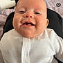 Kairo is registered to the contest to win money with this photo: baby, blurred_background, buttoned_shirt, casual_photo, child, closeup, face, furniture, happy, head, indoors, infant, lap, person, polka_dot, portrait, sitting, skin, smile, white_clothing