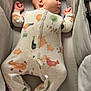 baby, sleeping, onesie, animal_print, crib, soft, peaceful, infant, pajamas, child, cute, cozy, bed, resting, newborn, comfort, indoor, pale_colors, fabric, small
