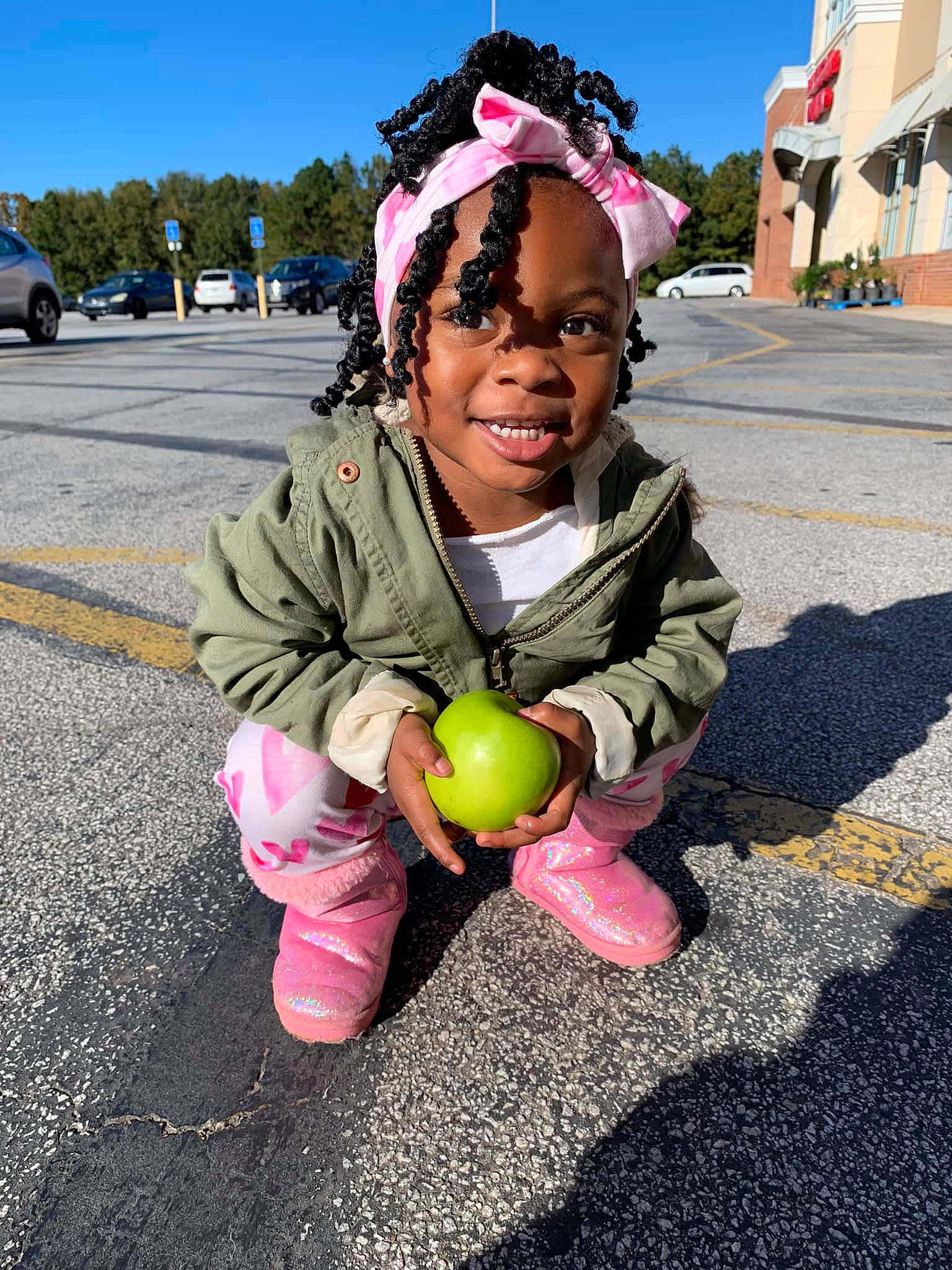 Ulanie is registered to the contest to win money with this photo: asphalt, child, event, fun, happy, joy, leisure, magenta, party_supply, person, personal_protective_equipment, pink, plant, public_space, recreation, road, road_surface, sky, street, travel