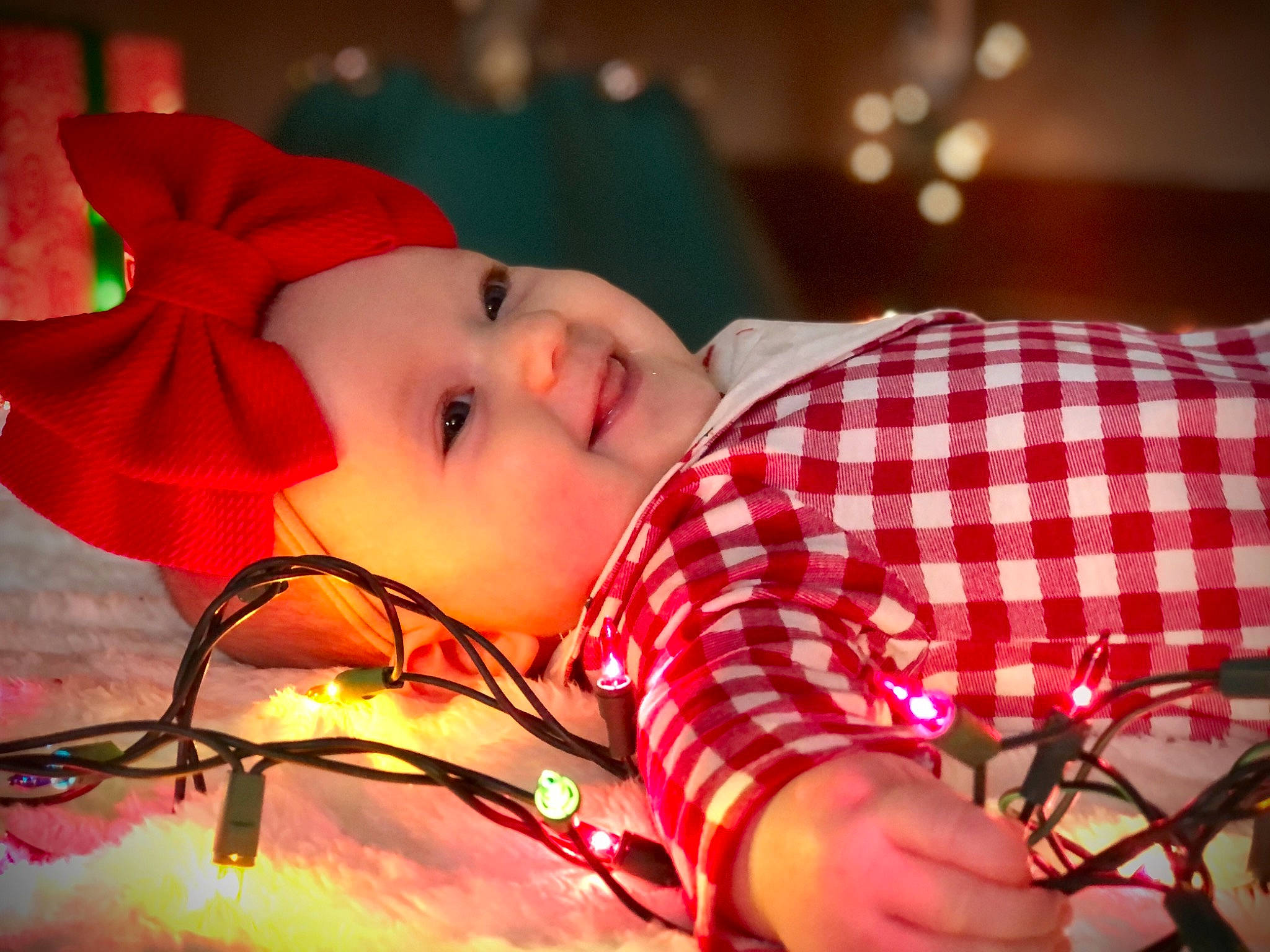 Graycen is registered to the contest to win money with this photo: baby, baby_toddler_clothing, carmine, child, christmas, headwear, holiday, joy, pattern, person, plaid, tartan, toddler