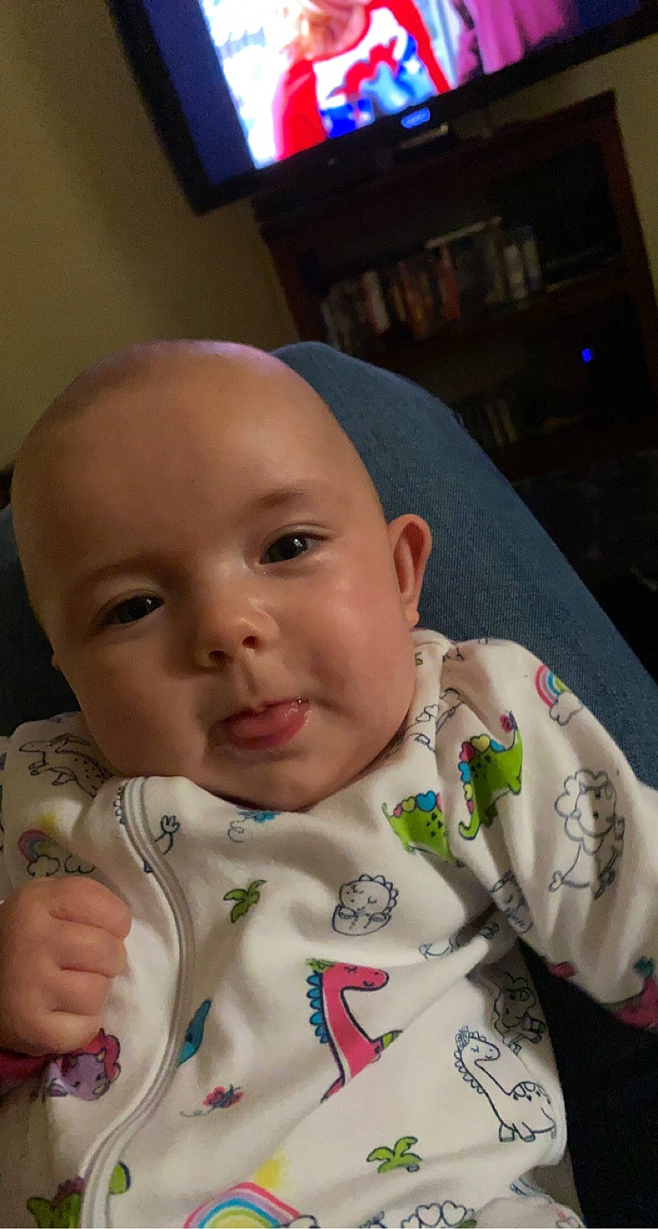 Aria is registered to the contest to win money with this photo: analog_television, baby, baby_bottle, baby_products, baby_toddler_clothing, cheek, child, display_device, ear, eye, eyebrow, forehead, iris, nail, nose, person, plastic_bottle, skin, television, television_set