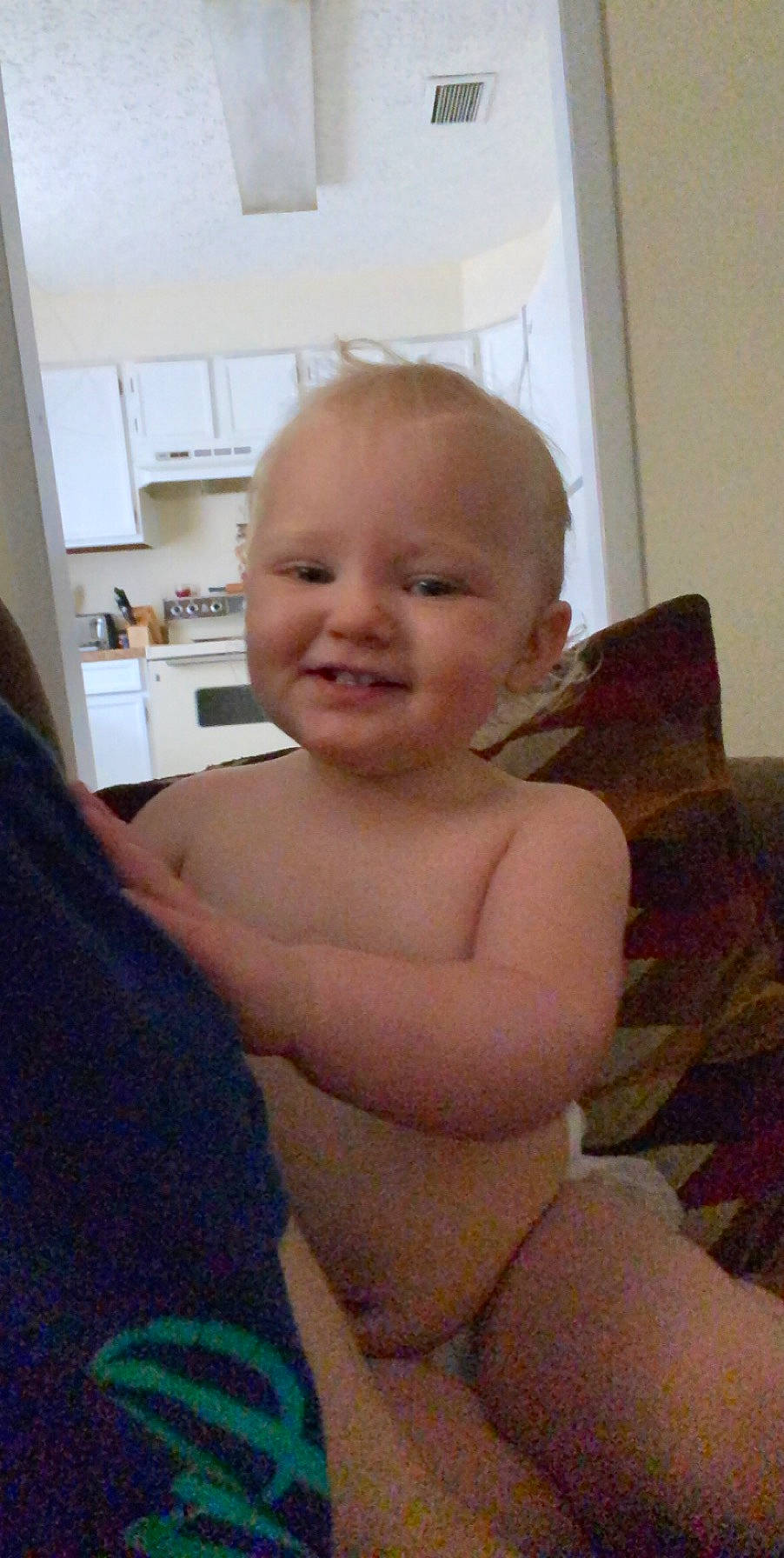 Anyla is registered to the contest to win money with this photo: abdomen, baby, barechested, blond, cheek, chest, child, chin, comfort, eyebrow, facial_expression, finger, joy, muscle, person, shelf, shoulder, sitting, skin, thumb