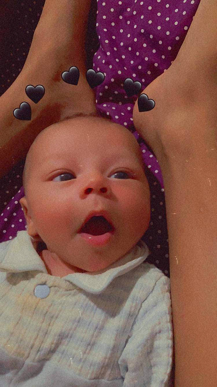 Adam is registered to the contest to win money with this photo: baby, baby_toddler_clothing, cheek, child, chin, close_up, eye, eyebrow, eyelash, fun, happy, iris, lip, magenta, mouth, nose, person, pink, skin, textile