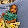 Nicole joined the competition — help win amazing prizes! baby, infant, hospital, blanket, clothing, medical_equipment, bed, smile, face, person, child, cute, lying_down, healthcare, gown, bright_eyes, hand, furniture, indoors, toddler