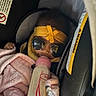 Nicole is registered to the contest to win money with this photo: baby, bottle, car_seat, blanket, sunglasses, headband, pink, yellow, infant, child, feeding, clothing, seatbelt, car, cute, sleeping, person, baby_bottle, indoor, resting