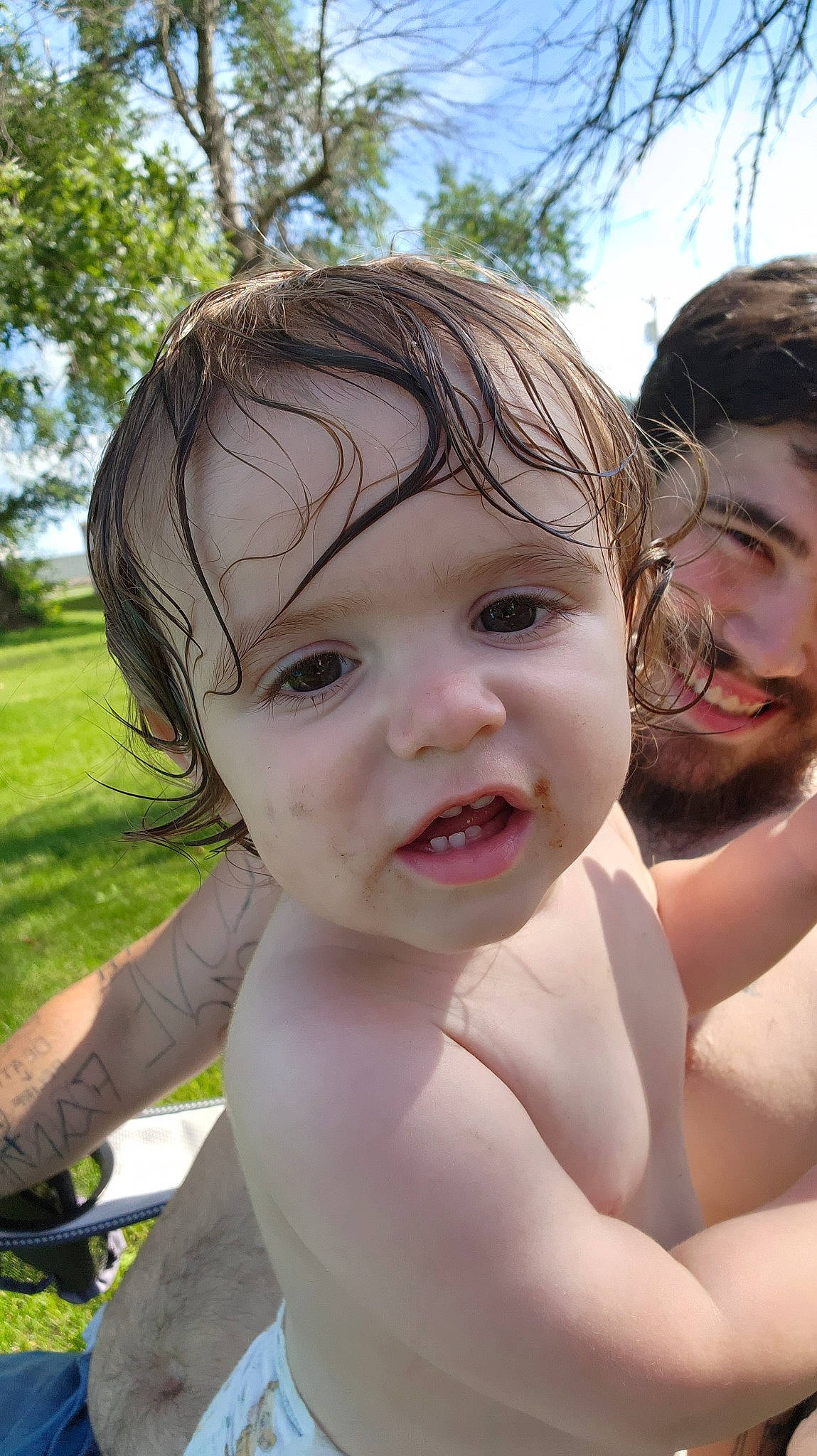 Paxton is registered to the contest to win money with this photo: cheek, chin, eye, eyebrow, face, gesture, grass, hair, happy, head, headwear, leisure, lip, nose, people_in_nature, person, plant, skin, sky, smile