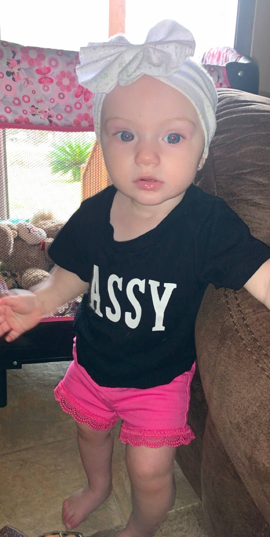 Carleigh is registered to the contest to win money with this photo: baby, baby_toddler_clothing, cheek, child, clothing, cool, ear, headgear, person, pink, skin, sleeve, t_shirt, toddler