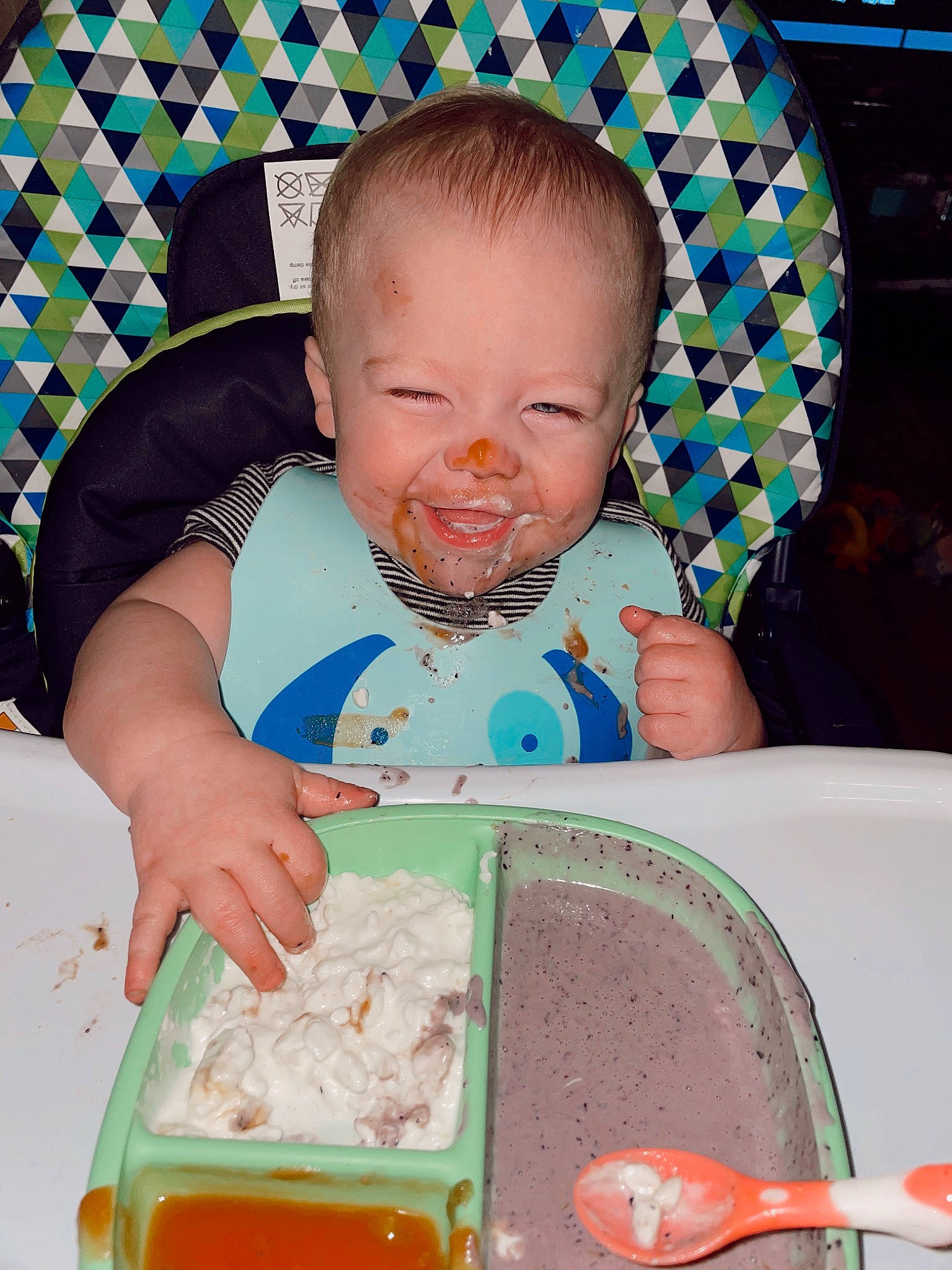 Kaelum is registered to the contest to win money with this photo: baby, baby_toddler_clothing, chair, cheek, child, comfort_food, cream, cuisine, dessert, dish, food, fun, green, happy, ingredient, kitchen_utensil, person, plate, sweetness, tableware