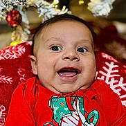 Sebasthian joined the competition — help win amazing prizes! baby, blanket, celebration, child, christmas_lights, christmas_tree, cute, face, festive, happy, holiday, indoors, infant, joyful, nike, ornament, portrait, red_shirt, seasonal, smiling
