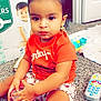 baby, ball, bathroom, boy, child, clothing, face, football, head, indoors, male, person, photography, portrait, shorts, sitting, soccer, soccerball, sport, t_shirt