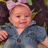 baby, child, smiling, denim, bow, headband, cute, portrait, face, happy, infant, clothing, lying_down, hand, patterned_blanket, blue_eyes, young_child, skin, cheeks, casual_wear