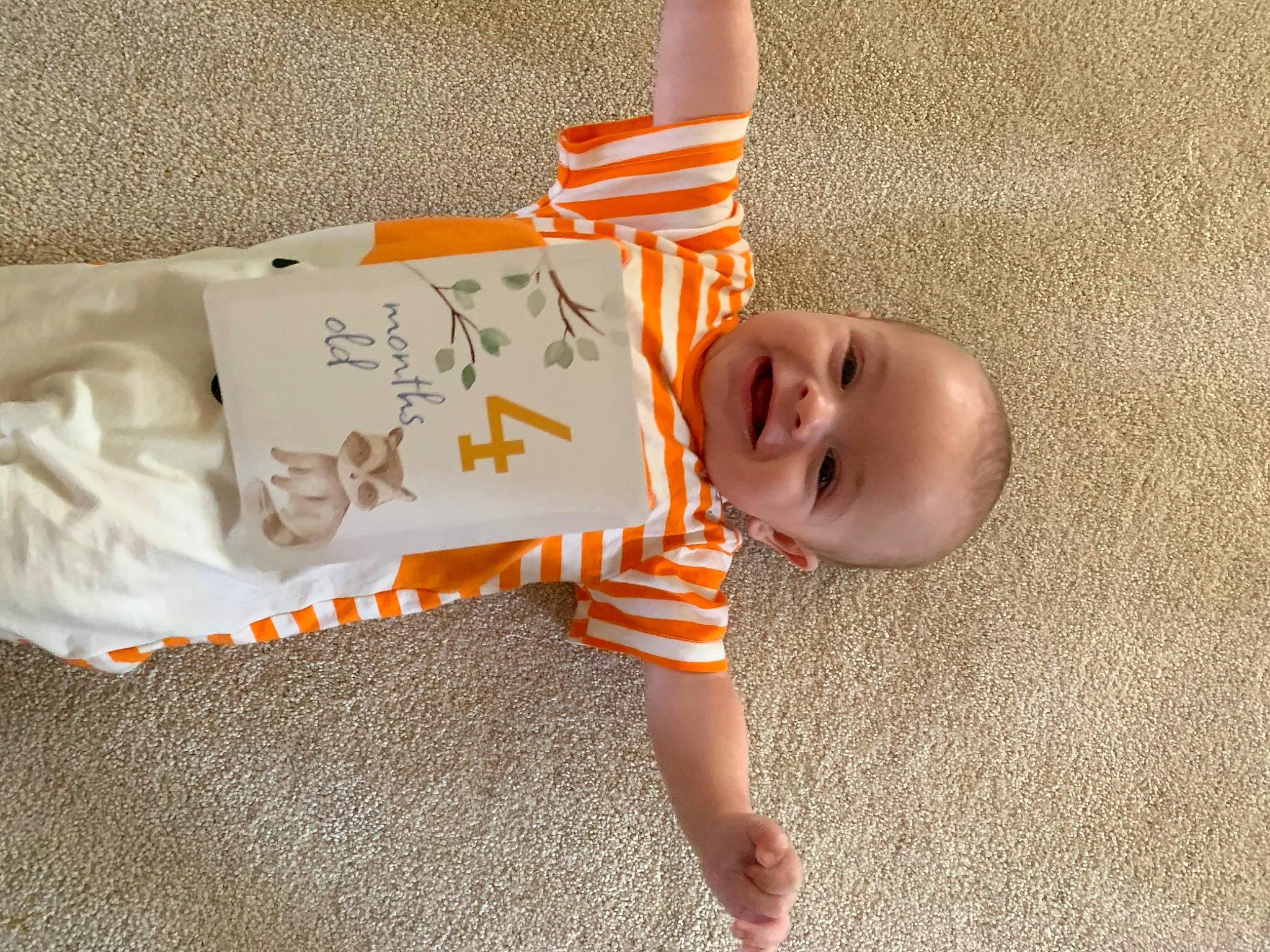 Ian joined the competition — help win amazing prizes! baby, baby_toddler_clothing, carmine, child, comfort, eye, finger, flooring, happy, human_body, joy, linens, mammal, orange, pattern, person, skin, sleeve, smile, toddler