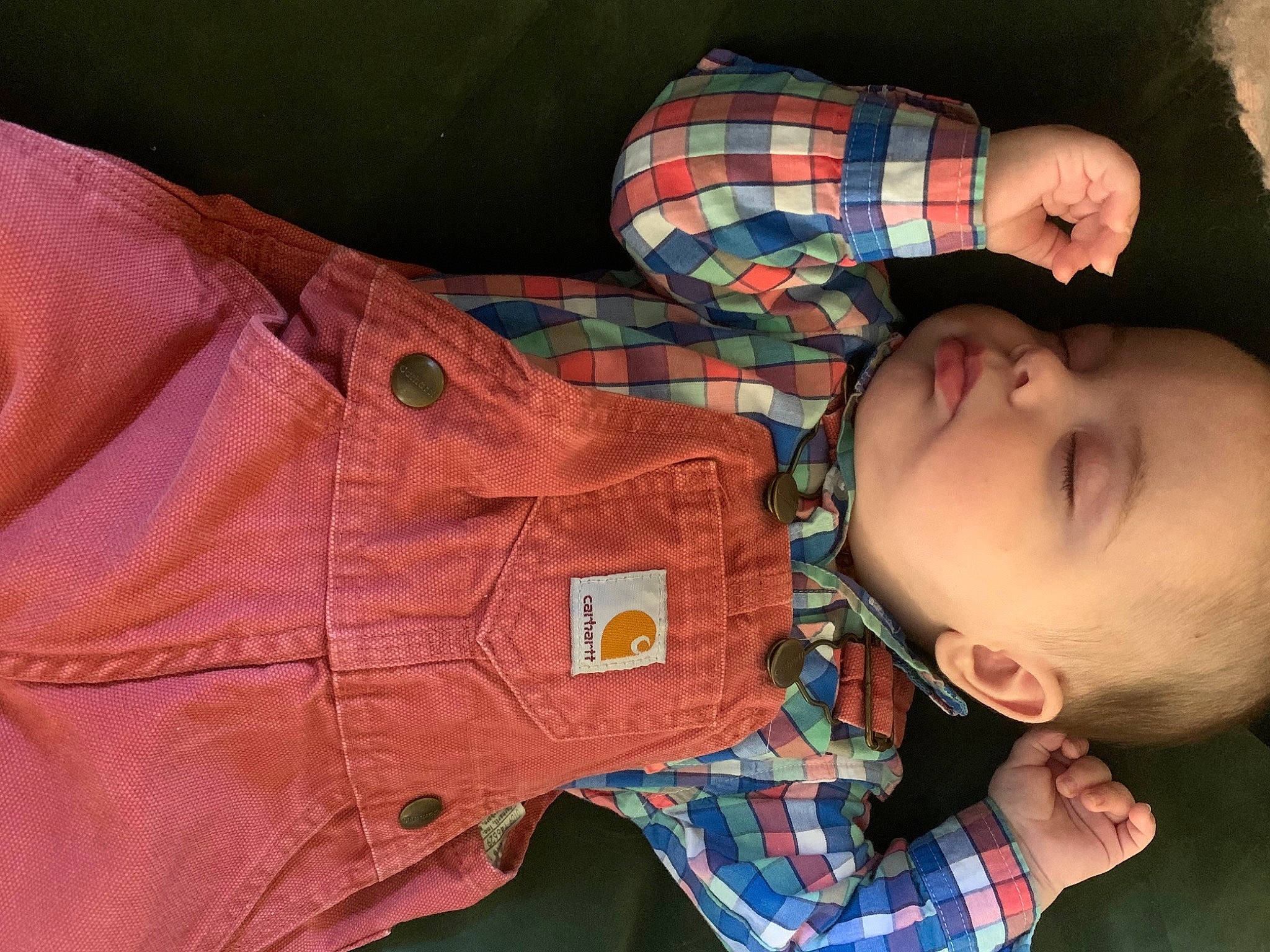 Ian is registered to the contest to win money with this photo: arm, baby, baby_toddler_clothing, beauty, cheek, collar, comfort, face, glasses, human_body, nose, orange, pattern, person, plaid, skin, sleeve, tartan, textile, toddler