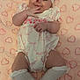 Destini-Grace is registered to the contest to win money with this photo: baby, infant, headband, pink, heart_pattern, blanket, white_outfit, socks, cute, smiling, lying_down, soft_texture, chubby_cheeks, indoors, adorable, child, portrait, fabric, patterned, clothing