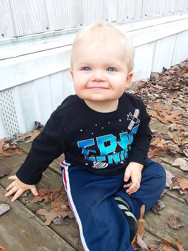 Braylon is registered to the contest to win money with this photo: baby, baby_products, baby_toddler_clothing, child, cool, face, head, joy, people, person, play, sitting, skin, sleeve, smile, t_shirt, toddler, vacation