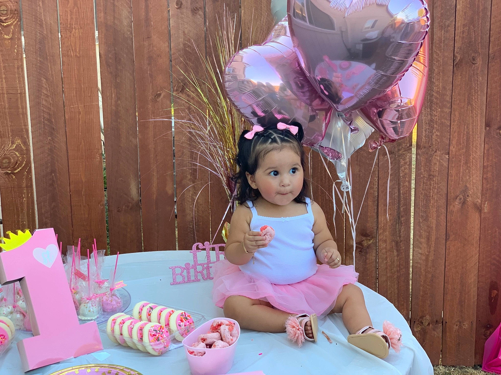 Liyla Reign is registered to the contest to win money with this photo: baby, birthday, child, doll, party, person, pink, sitting, sweetness, toddler