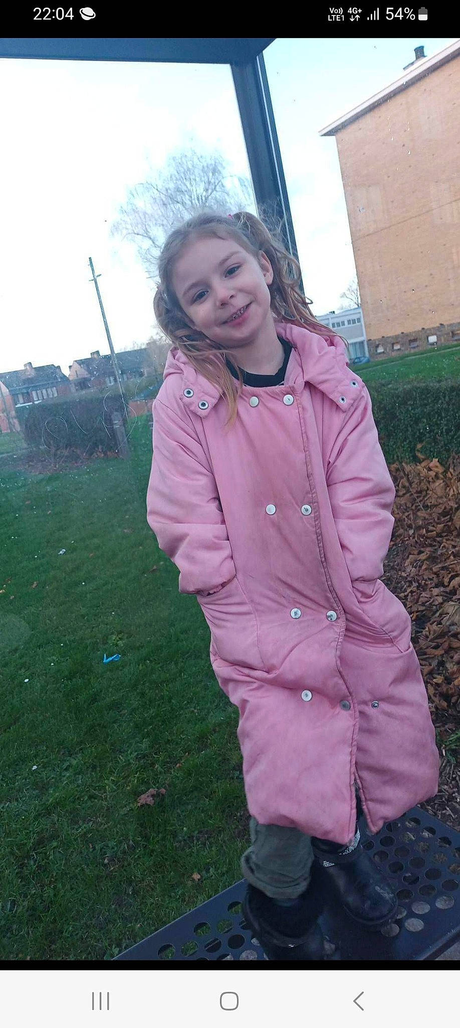 Emilie participe au concours pour gagner de l'argent avec cette photo : clothing, face, fun, grass, grassland, hair, happy, jacket, joy, long_hair, magenta, overcoat, pattern, person, plant, sky, sleeve, smile, toddler, tree