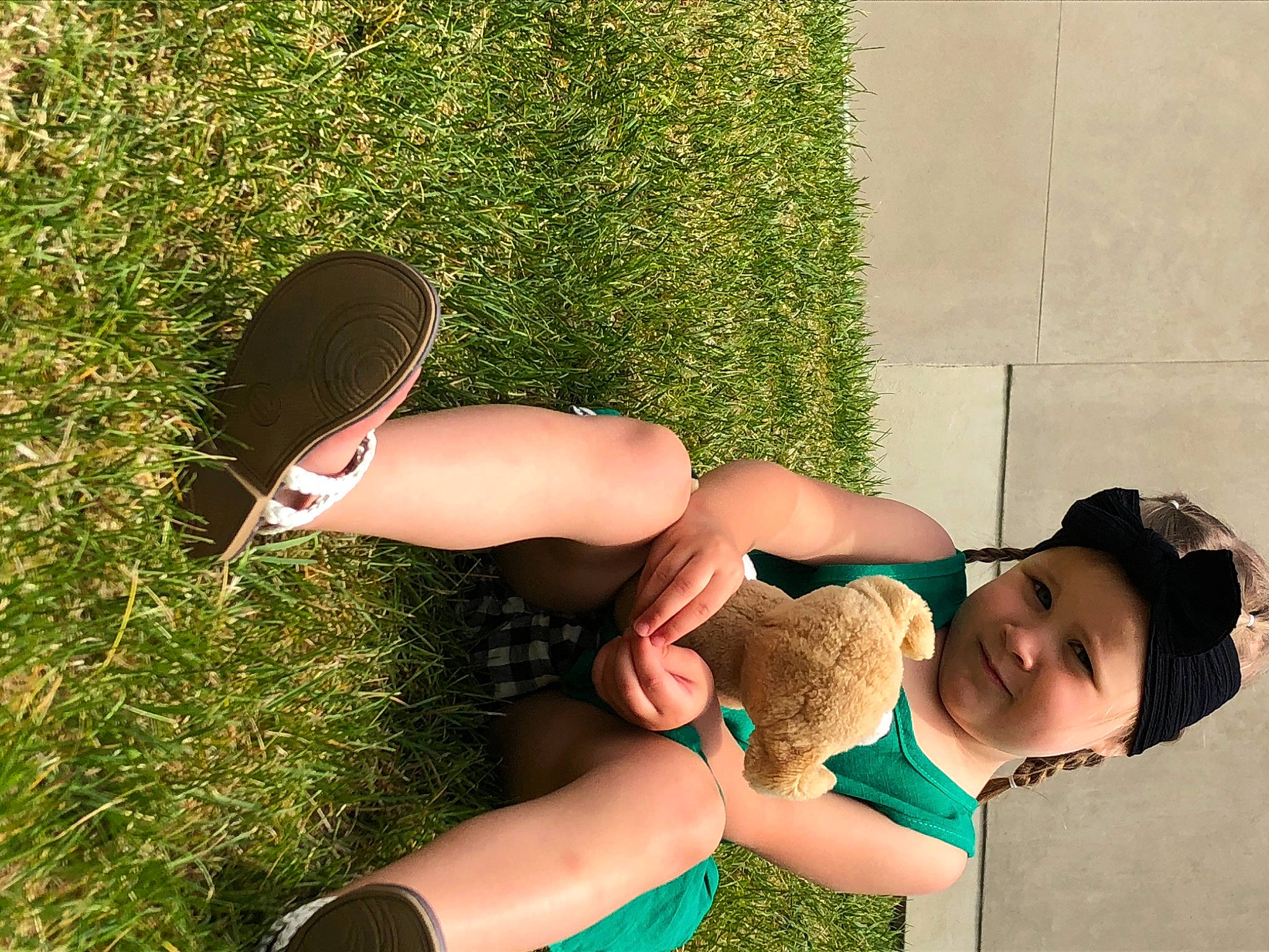 Annalee is registered to the contest to win money with this photo: arm, black_hair, fawn, footwear, fun, grass, headwear, human_leg, joy, leg, person, plant, shoe, summer, thigh