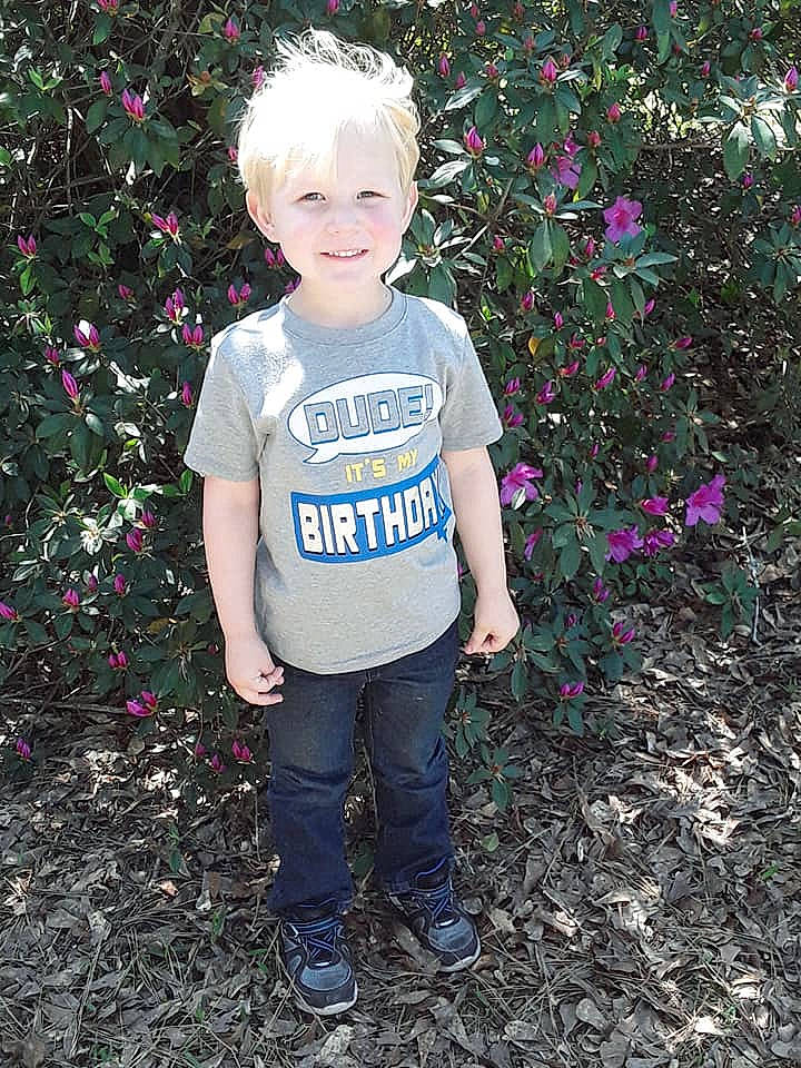 Gauge is registered to the contest to win money with this photo: child, flower, garden, grass, joy, leaf, person, pink, plant, shrub, t_shirt, toddler, tree