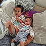 Enzo joined the competition — help win amazing prizes! child, baby, couch, pillow, socks, shoes, clothing, indoor, family, snack, baby_clothes, casual, relaxing, portrait, two_children, cute, comfortable, home, infant, toddler