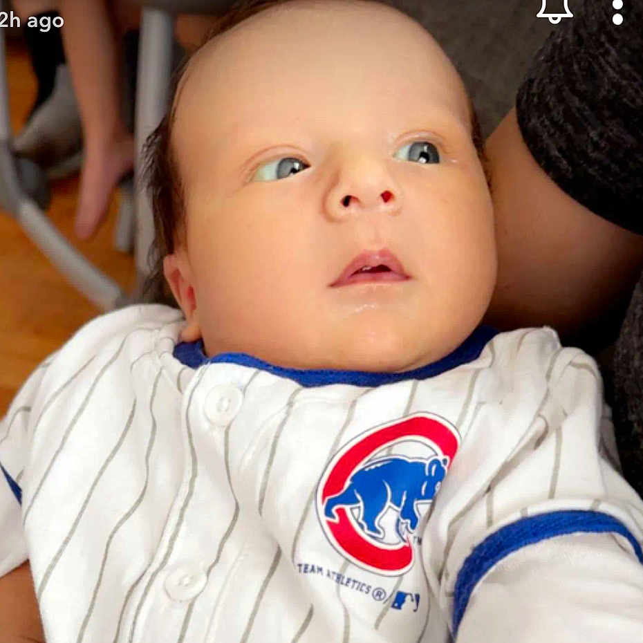 Enzo joined the competition — help win amazing prizes! baby, blue, child, clothing, cute, expression, eyes, face, head, indoor, infant, jersey, logo, person, portrait, skin, sleeve, sportswear, white, young